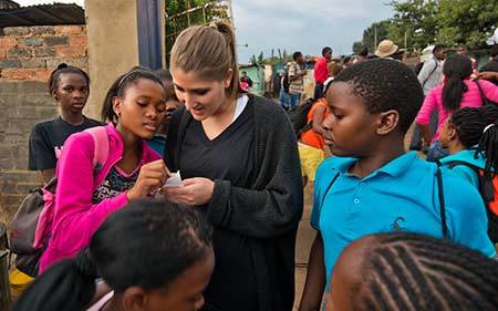 Laura Straccia talks with students at the Kliptown Youth Project near Johannesburg, South Africa